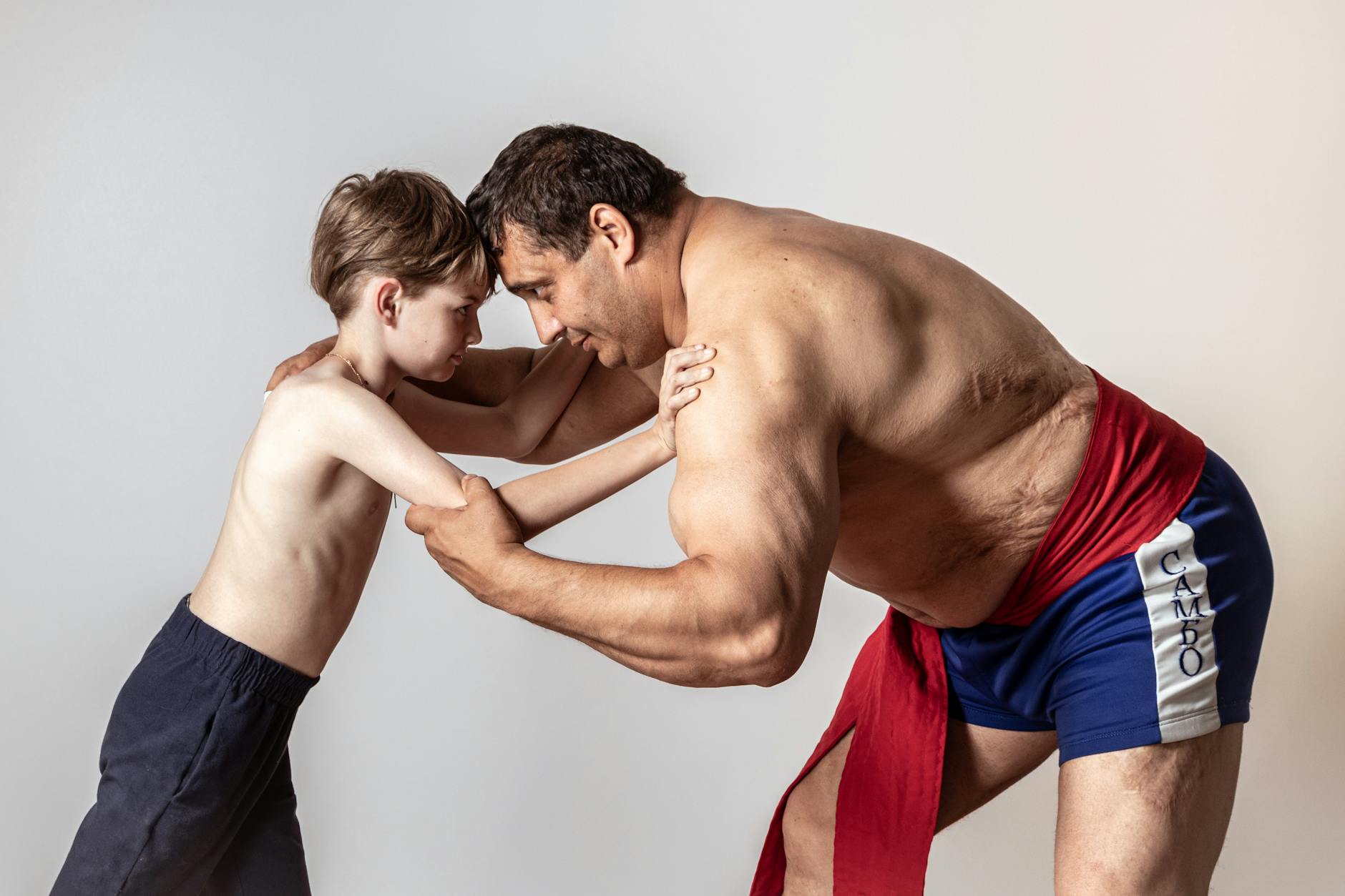 a boy wrestling with an athlete